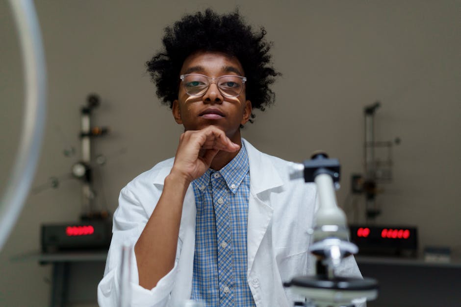 Portrait of a thoughtful scientist with eyeglasses in a laboratory setting.